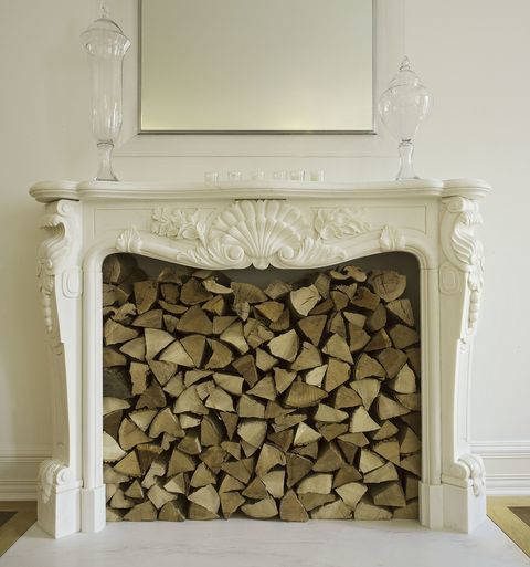 Using An Old Fireplace To Store Fire Wood